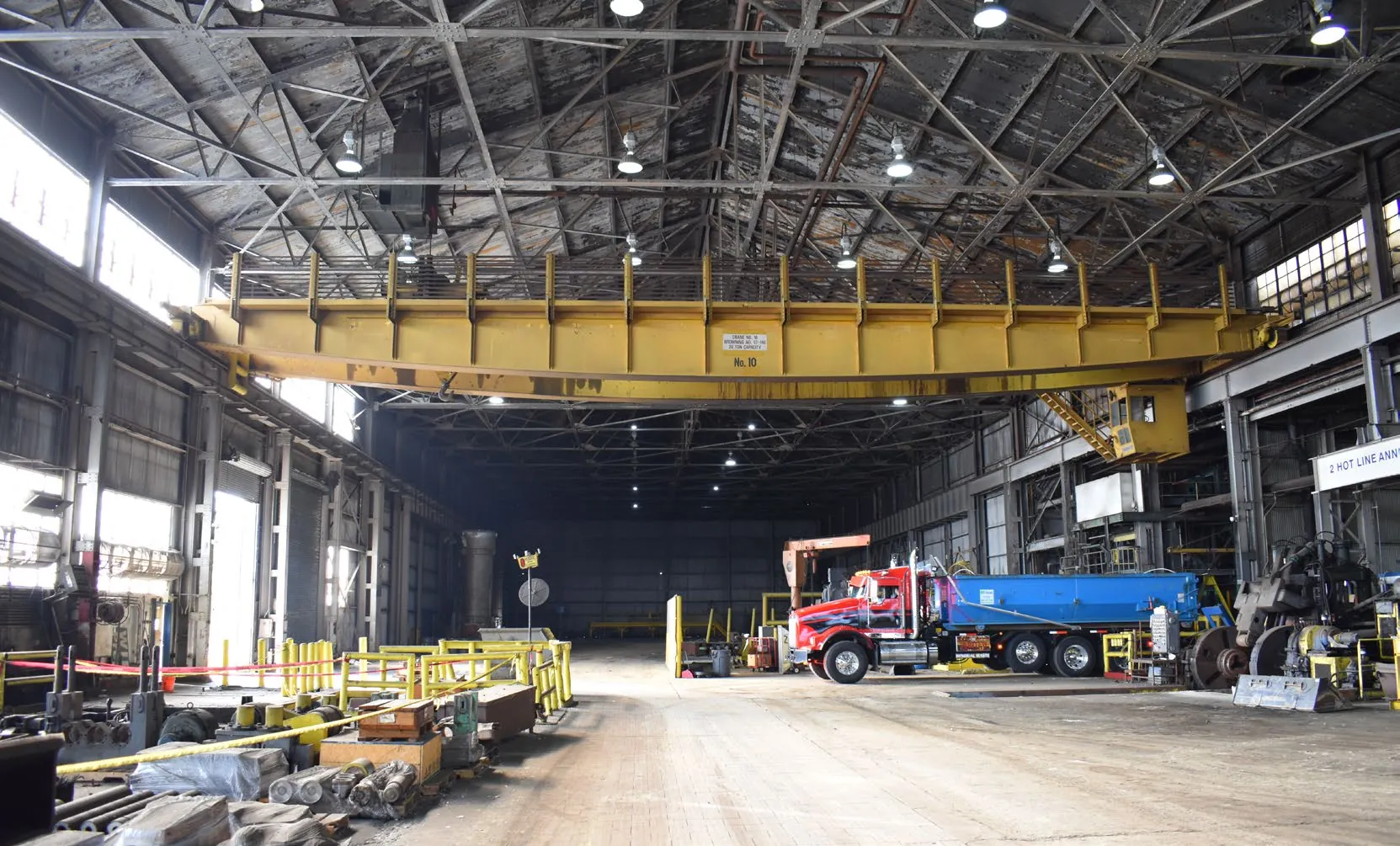 Truck loading under the heavy bridge crane in the load-out bay